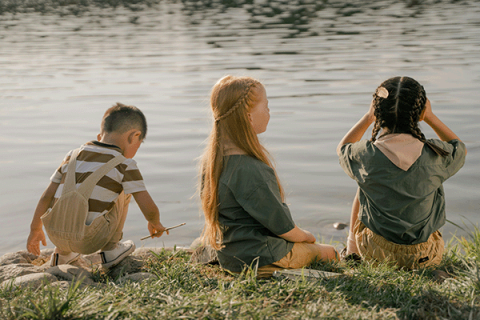 children by a lake