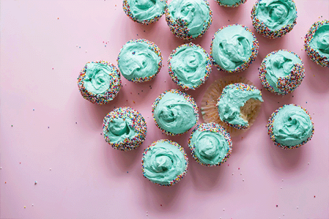 turquoise frosted cupcakes with sprinkles