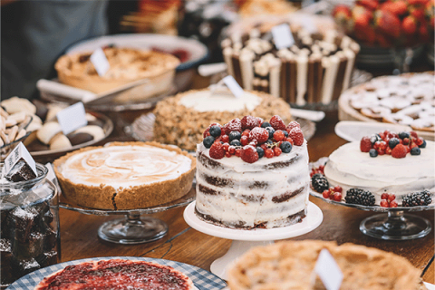 table featuring a wide variety of desserts