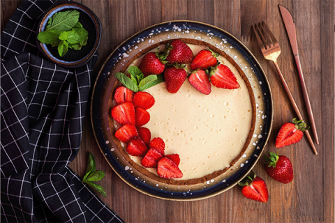 cheesecake decorated with strawberries