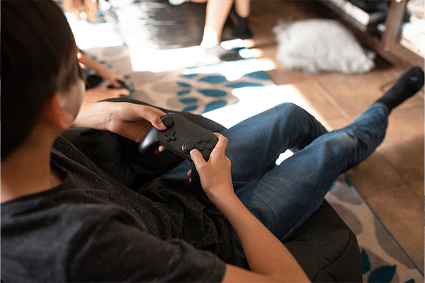 teen sitting in a beanbag chair