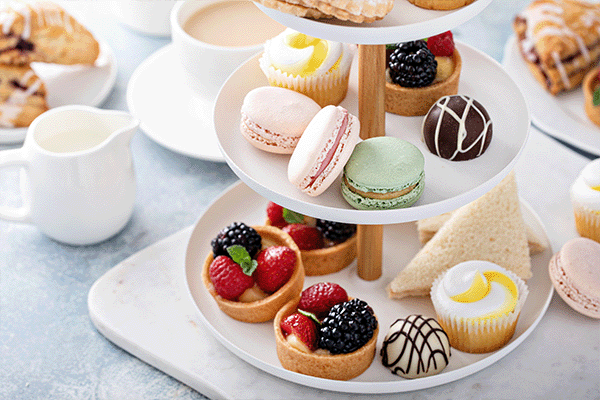 beautiful desserts on a tiered tea tray