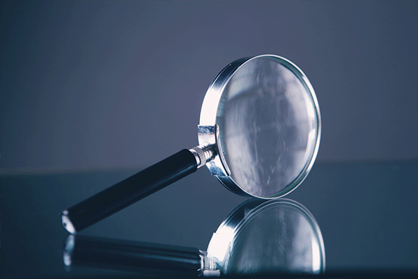 magnifying glass propped up on its side